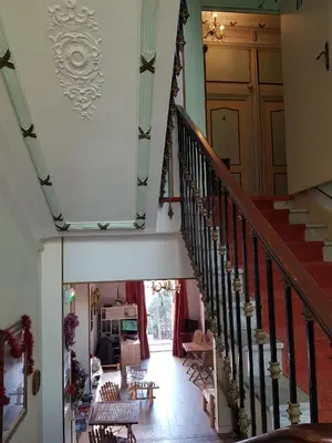 a hallway with a staircase in a house at Villa Eden in Nice
