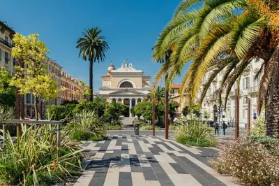 a street with palm trees and a building at Les Gérardines by EnjoyNice, 3-room with Airco and balcony in Nice