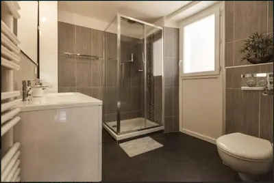 a bathroom with a shower and a toilet and a sink at Nice Renting - COLONNA - Best place in Nice Old Town in Nice