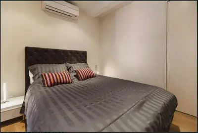 a bedroom with a large bed with two pillows at Nice Renting - COLONNA - Best place in Nice Old Town in Nice