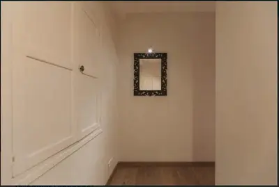a white room with a mirror on a wall at Nice Renting - COLONNA - Best place in Nice Old Town in Nice