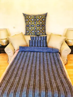 a large bed in a room with two lamps at Chez Kari-top location in charming old town in Nice