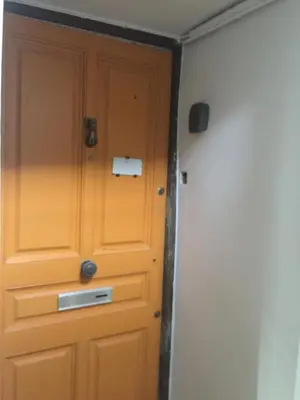a door in the corner of a room at Le Noble in Scenic Villefranche Sur Mer in Villefranche-sur-Mer