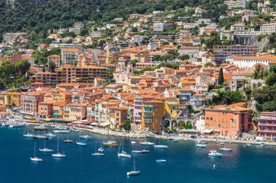 a group of boats in a harbor with a city at Le Noble in Scenic Villefranche Sur Mer in Villefranche-sur-Mer