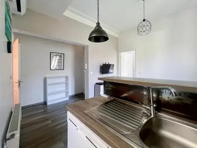 a kitchen with a sink and a counter at Proche promenade des anglais et de la mer in Nice