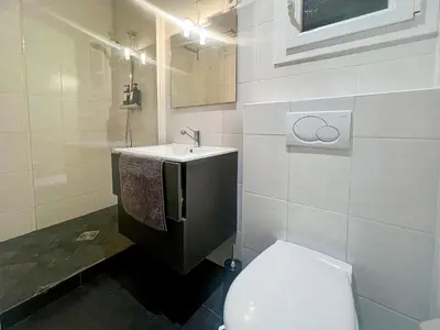a bathroom with a toilet and a sink at Proche promenade des anglais et de la mer in Nice