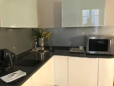 a kitchen with a microwave and a sink at Je suis à Nice in Nice