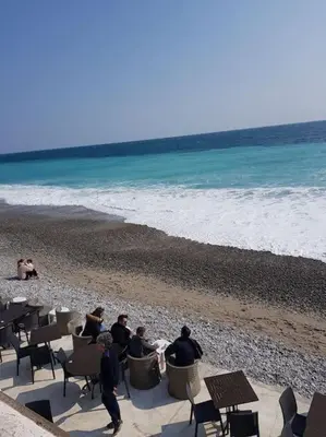 a group of people sitting in chairs on the beach at Studette en plein cœur du Vieux Nice in Nice