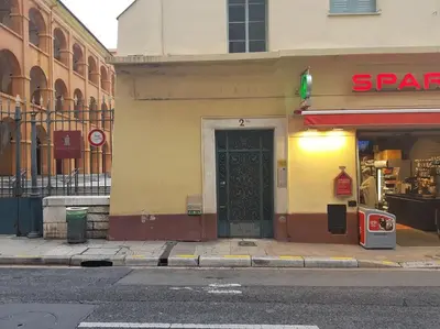 a store front with a door on a city street at Studette en plein cœur du Vieux Nice in Nice