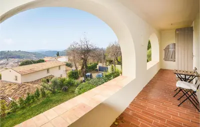 a view from the balcony of a house with an archway at Awesome Home In La Gaude With Kitchen in La Gaude