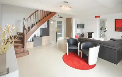 a living room with a couch and a red rug at Awesome Home In La Gaude With Kitchen in La Gaude