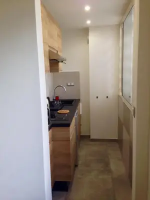 a small kitchen with a sink and a counter at Studio 33 in Nice