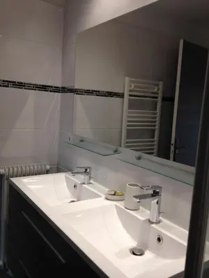 a bathroom with a white sink and a mirror at Le Cros de Cagnes in Cagnes-sur-Mer