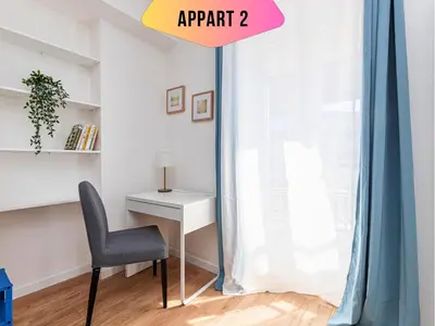 a room with a desk and a chair next to a window at CASA REINE JEANNE- ideal groups & family -CENTRAL near train station - PARKING - New&CONFORT-AC in Nice