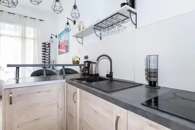 a kitchen with a sink and a counter at Nice Centre Flat - Modern, Quiet and Brand New in Nice