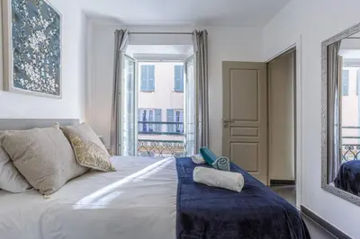a bedroom with a bed with two towels on it at MY CASA - PARADIS - Carré d Or 1 room - Balcony Sea View in Nice