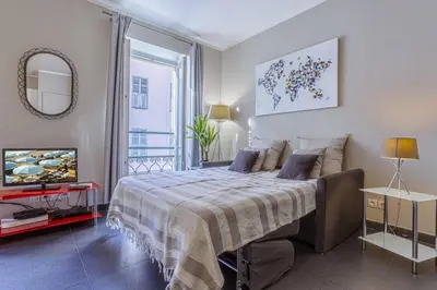 a bedroom with a bed and a television in it at MY CASA - PARADIS - Carré d Or 1 room - Balcony Sea View in Nice