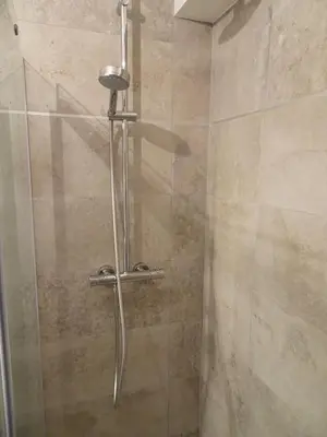 a shower with a glass door in a bathroom at 