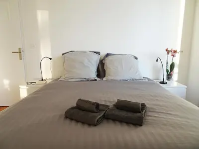 a bed with two towels and two pillows on it at 