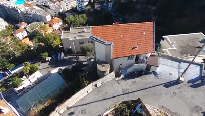 an overhead view of a house with a red roof at Maison / Appart Le PIOL in Nice