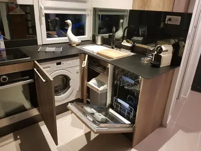 a kitchen with a washer and a washing machine at Maison / Appart Le PIOL in Nice