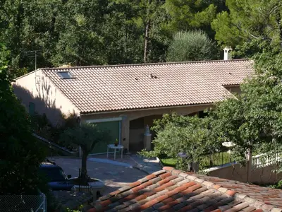 a house with a tile roof and a driveway at Mikado in La Gaude