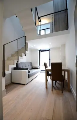 a living room with a couch and a table at Residence Tonduti in Nice