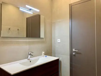 a bathroom with a sink and a mirror at Florida Blue - Easy Home Booking in Nice