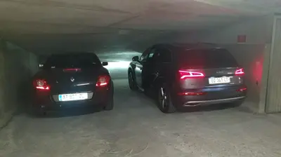 two cars are parked in a parking garage at Nissa La Bella in Nice