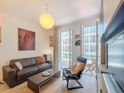 a living room with a couch and a table at Nestor&Jeeves - TROIS PROMENADE - Central - Very close sea in Nice