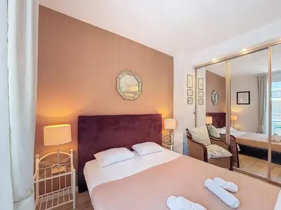 a bedroom with a bed with two white towels on it at Nestor&Jeeves - TROIS PROMENADE - Central - Very close sea in Nice