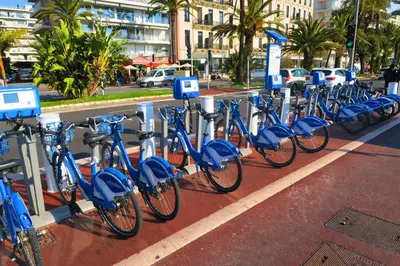 a row of blue bikes parked in a parking lot at Nestor&Jeeves - MARIN DEBUSSY - Central - By shopping area in Nice