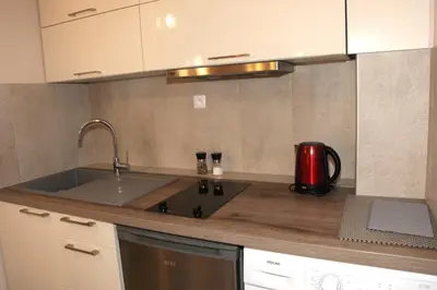 a kitchen counter with a sink and a microwave at Stylish 2 Room Flat 60 meters to the beach in Nice