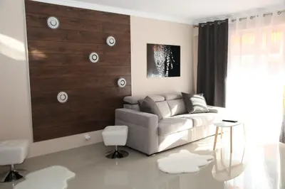 a living room with a couch and a table at Stylish 2 Room Flat 60 meters to the beach in Nice