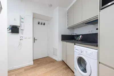 a white laundry room with a washer and dryer at Quiet and cosy 1bdr in Vieux Nice! in Nice
