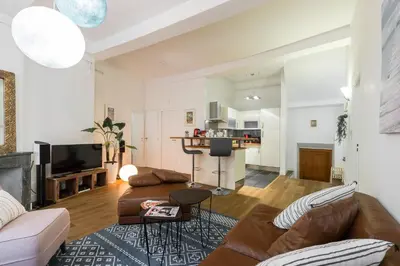 a living room with a couch and a table at PREF 2 · F4 - VASTE ET BOURGEOIS ,3 CHAMBRES, ASCENSEUR, VX-NICE in Nice