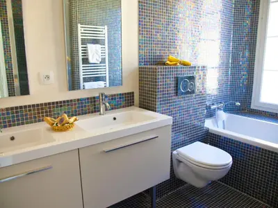 a bathroom with a sink and a toilet and a tub at La Garibaldi in Nice