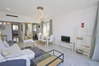 a living room with a couch and a table at MILORD PROMENADE 2 - PROMENADE HOLIDAY in Nice