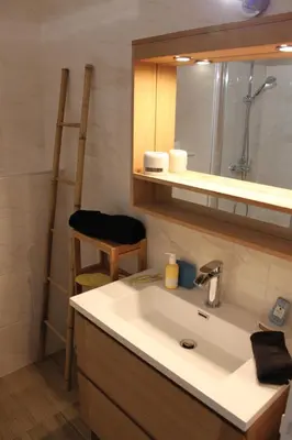 a bathroom with a sink and a mirror at Oasis Méditerranéen Piscine & Parking Calme absolu in Nice