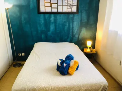 a glass desk with a chair in a room at Le Californie Côte d'azur plage les pieds dans L'eau in Nice