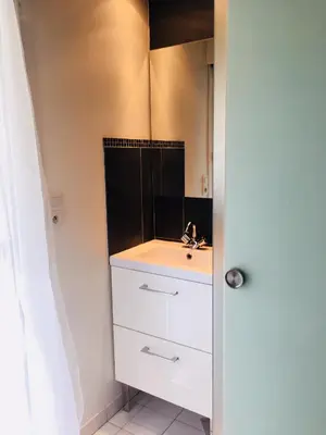 a bathroom with a shower with a shower curtain at Le Californie Côte d'azur plage les pieds dans L'eau in Nice