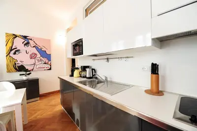 a kitchen with a sink and a counter top at Suite Halevy 5 stars Holiday House in Nice