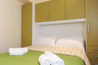 a bedroom with a bed with towels on it at Suite Halevy 5 stars Holiday House in Nice
