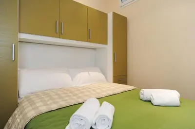 a bedroom with a bed with towels on it at Suite Halevy 5 stars Holiday House in Nice