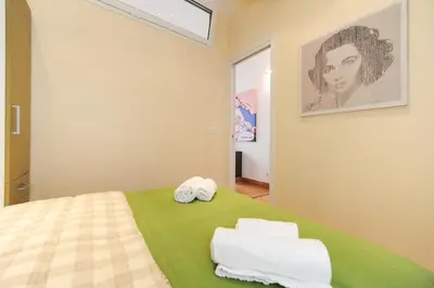 a bedroom with a bed with towels on it at Suite Halevy 5 stars Holiday House in Nice