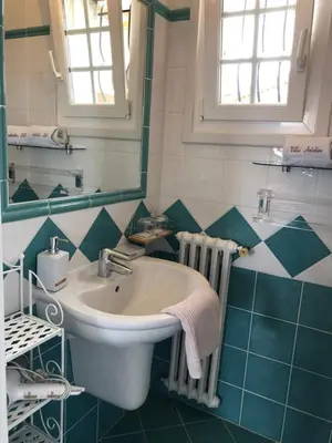 a bathroom with a sink and a mirror at Villa Antoline in Cagnes-sur-Mer