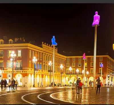 a city street with a large building at night at France Nice Promenade Des Anglais 80m² Piano in Nice