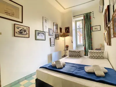 a bedroom with a bed with two pillows on it at Nestor&Jeeves - SIXTIES - Central - Very close sea - Retro in Nice