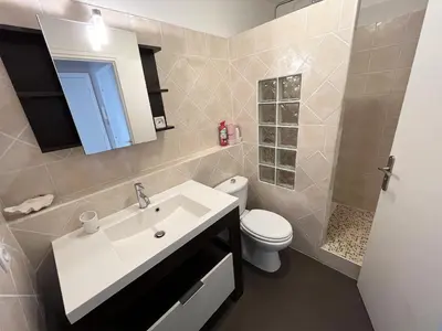 a bathroom with a sink and a toilet at Maresol in Cagnes-sur-Mer
