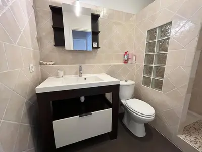 a bathroom with a white sink and a toilet at Maresol in Cagnes-sur-Mer